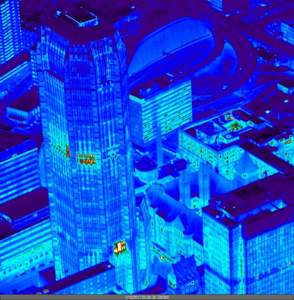 Aerial infrared image showing suspected moisture across a commercial roof