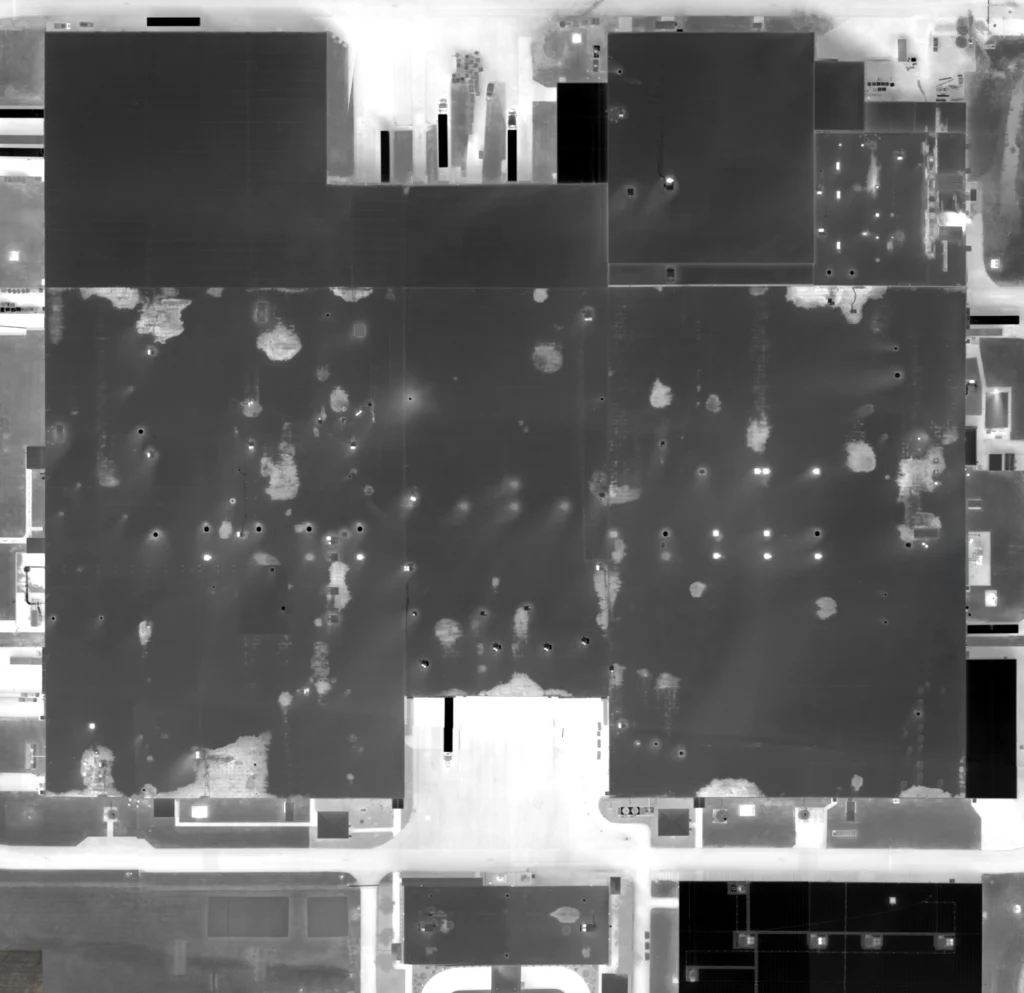 Aerial infrared roof scanning image showing thermal anomalies across a large commercial roof during a roof moisture survey